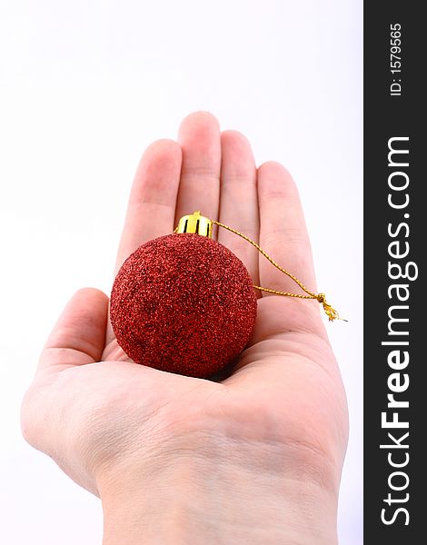 Red christmas ball with hand isolated on white. Red christmas ball with hand isolated on white