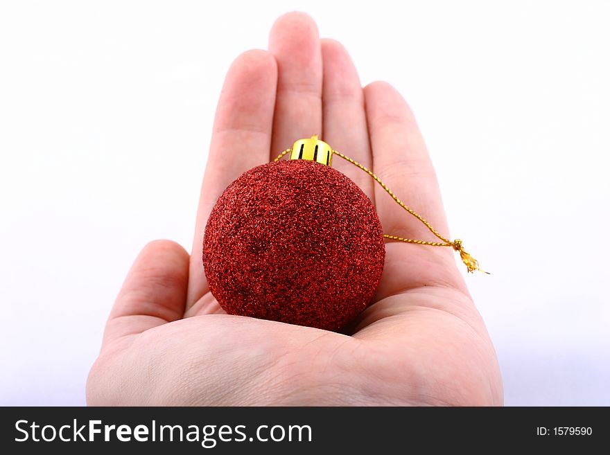 Red christmas ball with hand isolated on white. Red christmas ball with hand isolated on white