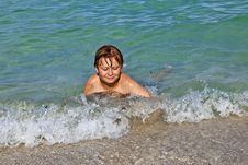 Boy Enjoys The Clear Water In The Ocean Royalty Free Stock Photography