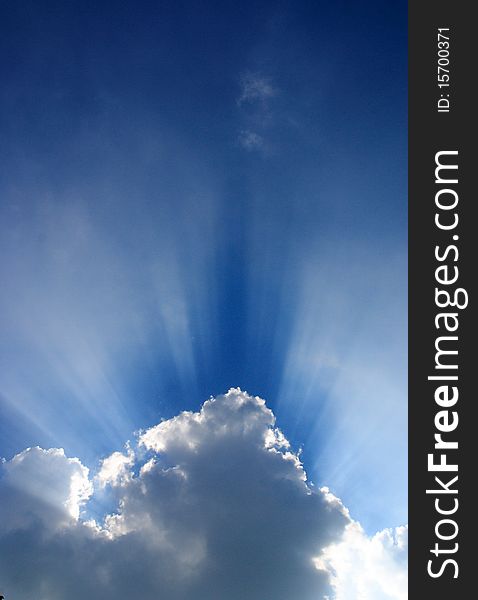 Blue sky, white clouds, solar light shining in all directions, beautiful sky. Blue sky, white clouds, solar light shining in all directions, beautiful sky