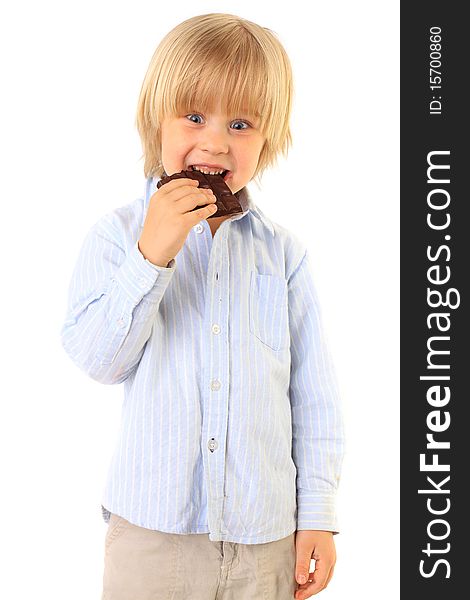 Happy kid eating chocolate isolated on white