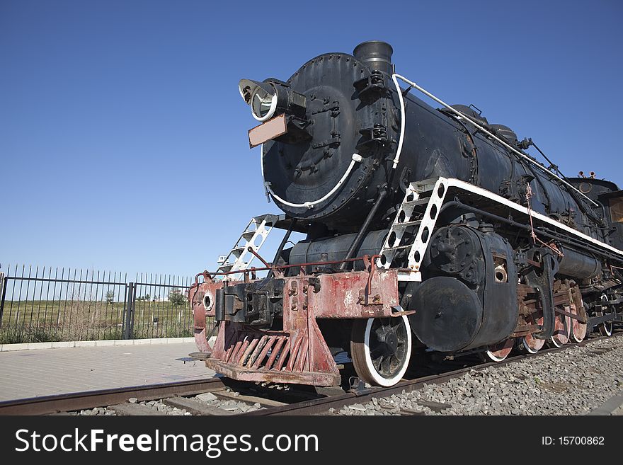 The old locomotive train running outside. The old locomotive train running outside