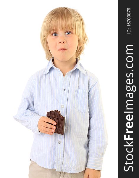 Happy child eating chocolate isolated on white. Series. Happy child eating chocolate isolated on white. Series