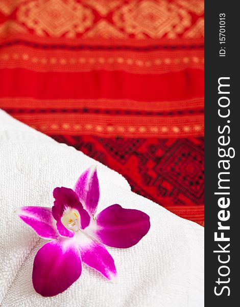 Ochid on white towel in Thai style hotle. Ochid on white towel in Thai style hotle