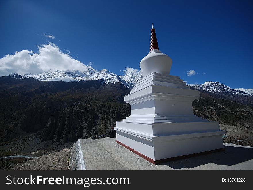 White stupa in the mountains of Nepal in the around Annapurna trek in Nepal. White stupa in the mountains of Nepal in the around Annapurna trek in Nepal