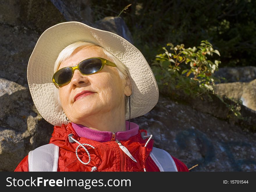 Old woman with mountains flowers. Old woman with mountains flowers