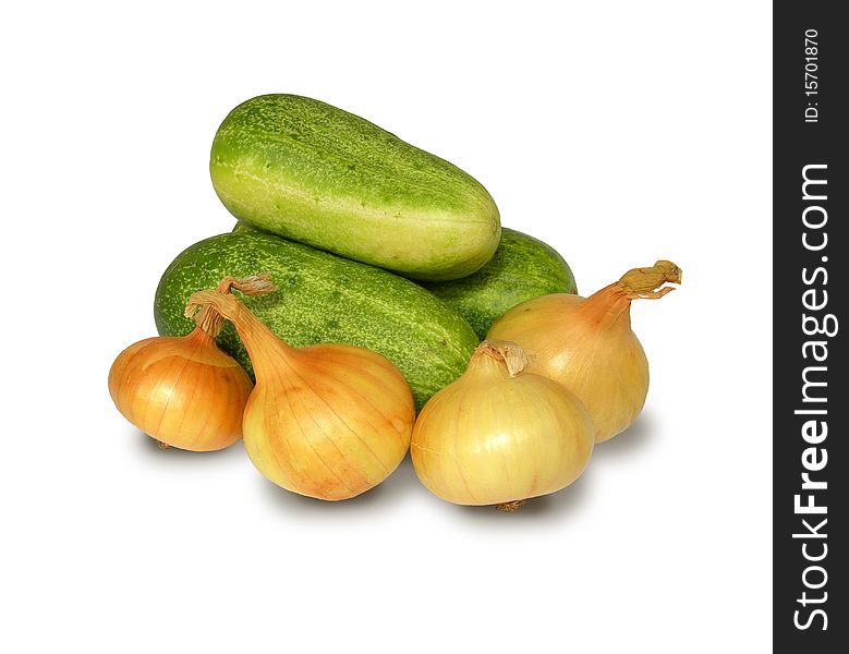 Ripe cucumbers and onions are shown in the picture. Ripe cucumbers and onions are shown in the picture.