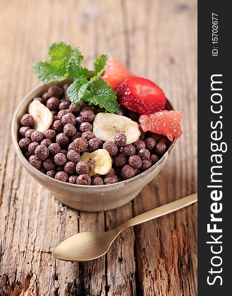 Bowl of chocolate breakfast cereal and fruit