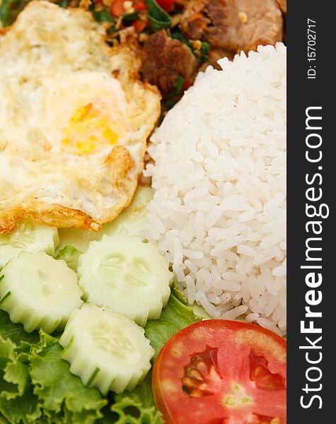 Crunchy pork fried with basil leaf and egg. Crunchy pork fried with basil leaf and egg