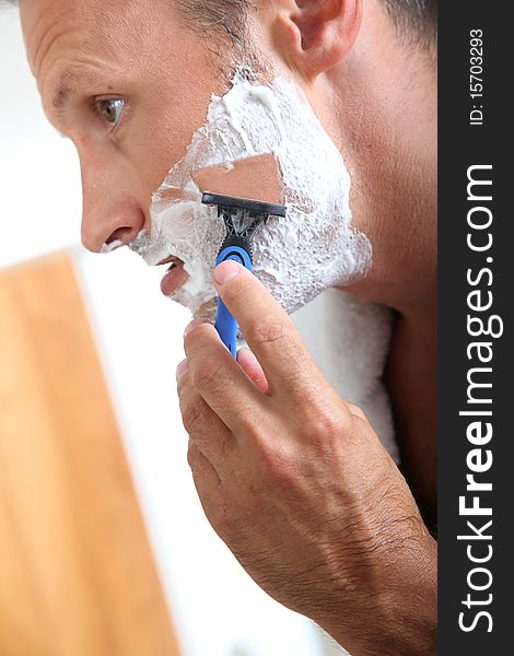 Man shaving with razor