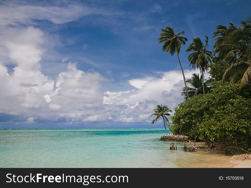 Maldives Medhufushi Island  blue ocean and cloudy sky. Maldives Medhufushi Island  blue ocean and cloudy sky