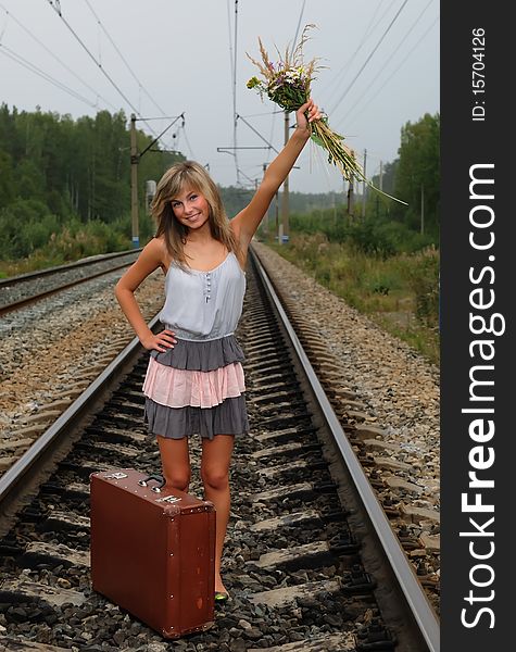 The Young Beautiful Girl At A Station