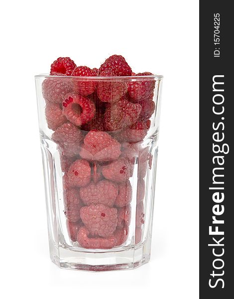 Glass full of fresh delicious raspberries