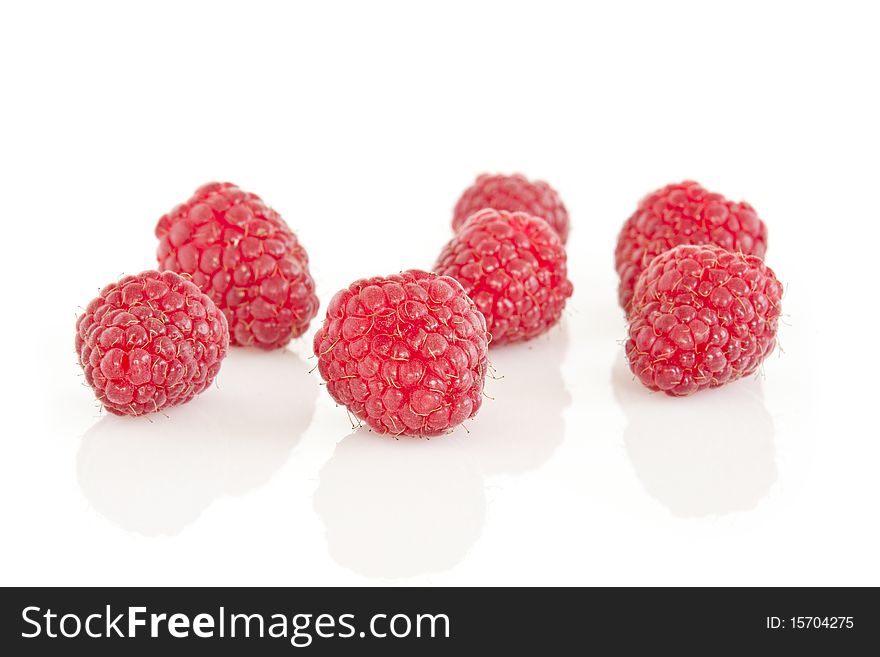 Group of raspberries isolated on white