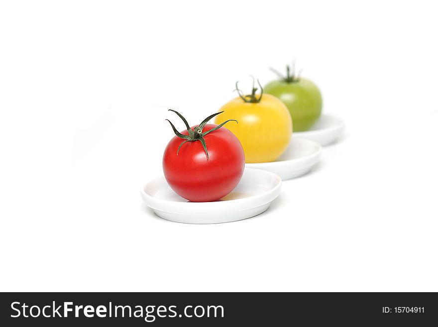Colorful organic  tomatoes on plates