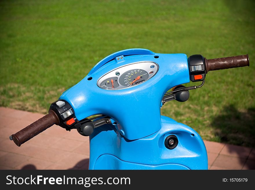 Blue scooter on parking lot. Blue scooter on parking lot