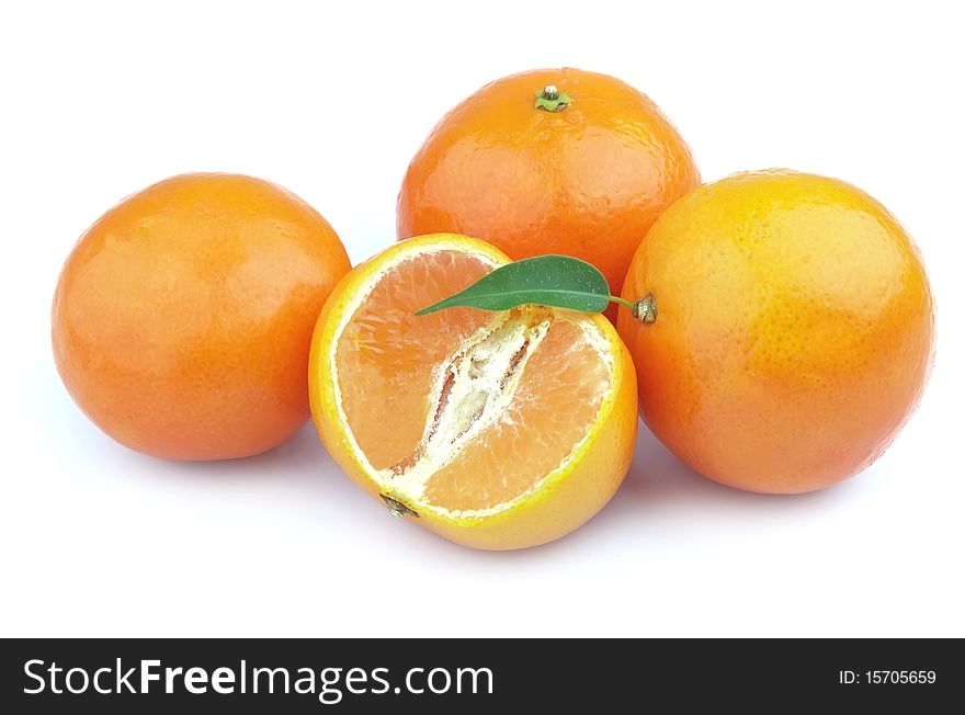 Tangerines entirely and segments and with leaves close up. Tangerines entirely and segments and with leaves close up