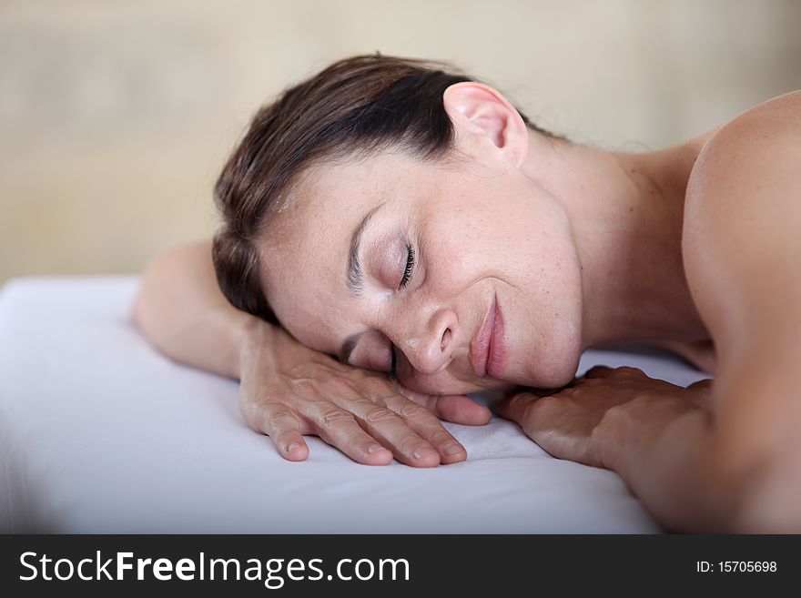 Woman relaxing on a massage bed. Woman relaxing on a massage bed