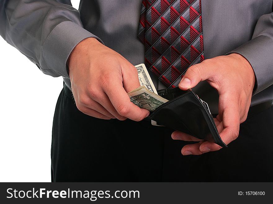 The businessman in a grey shirt and a tie hides money in a purse. The businessman in a grey shirt and a tie hides money in a purse.