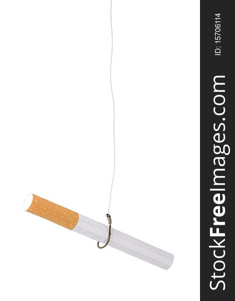 A filtered cigarette hooked on a fishing hook; addiction concept. A filtered cigarette hooked on a fishing hook; addiction concept.