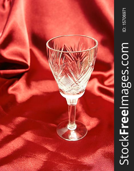Goblet on the red cloth background