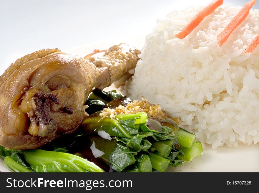 Steamed Garlic chicken and rice on white plate