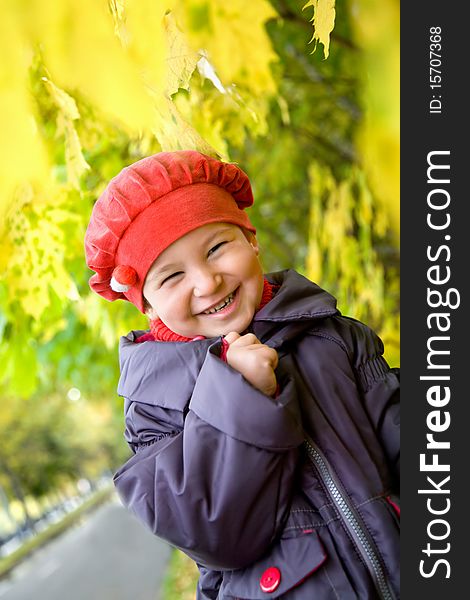 Portrait of little girl in autumnal park