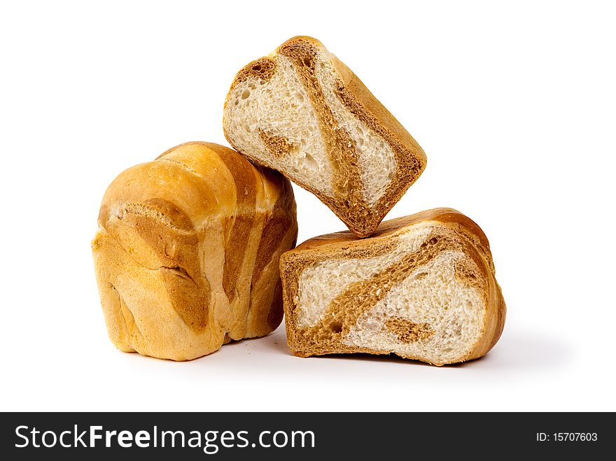Loaf of bread and two pieces of bread isolated on white background. Loaf of bread and two pieces of bread isolated on white background