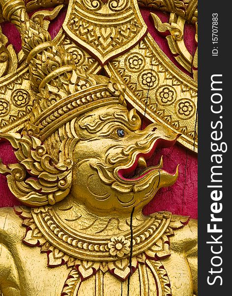 Garuda carved gold paint on church door. Garuda carved gold paint on church door