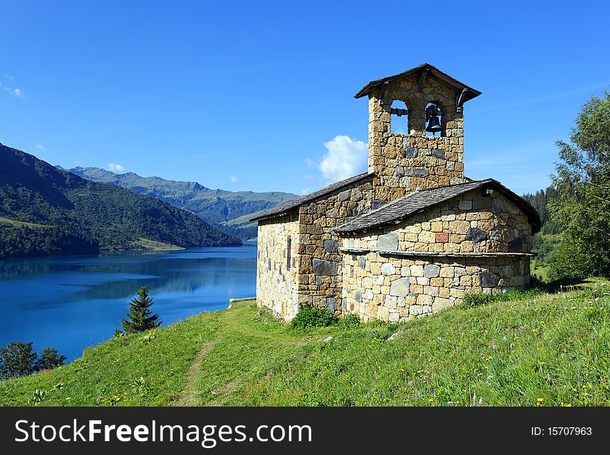 Chapel and lake in french mountain