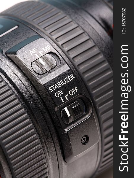 Closeup shot of image stabilizer controls on lens.
