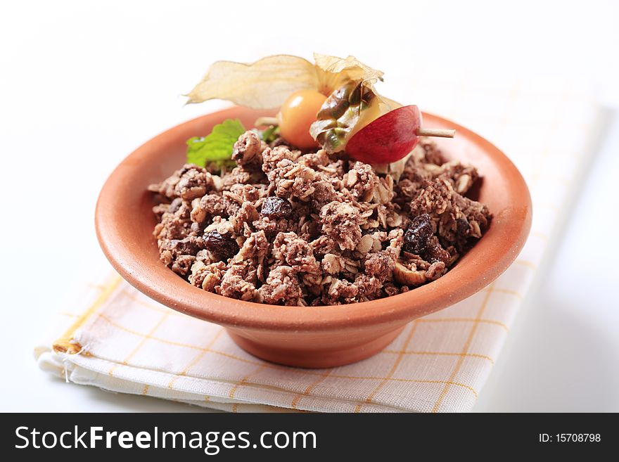 Chocolate breakfast cereal in a terracotta bowl