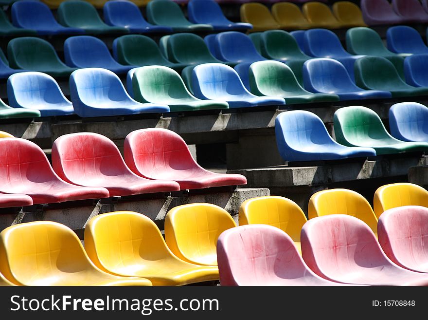 Rows of empty stadium seats.