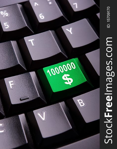 Sign of million dollars on a close-up computer button. Sign of million dollars on a close-up computer button