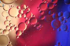 Oil Bubbles With Blue, Red And Yellow Reflections Stock Photo