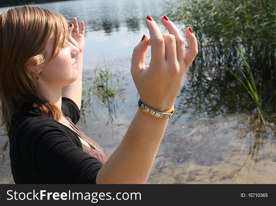 Young woman sitting and meditating. Young woman sitting and meditating