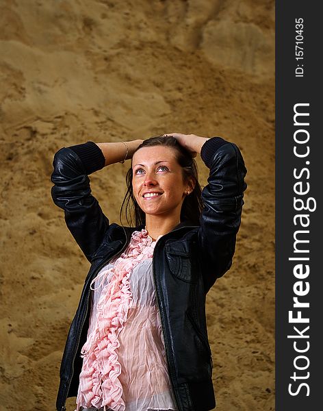 Beautiful woman posing with raised hands and looking up - dreaming about future