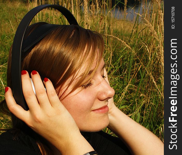 Young woman listening to music.
