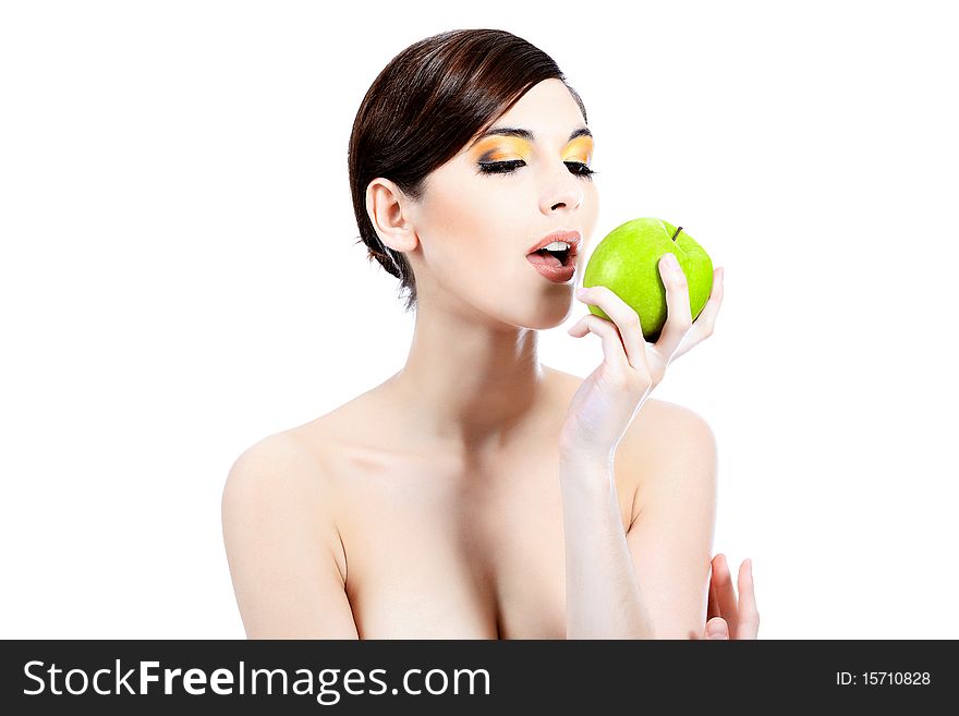 Shot of a beautiful young woman holding green apple. Isolated over white background. Shot of a beautiful young woman holding green apple. Isolated over white background.