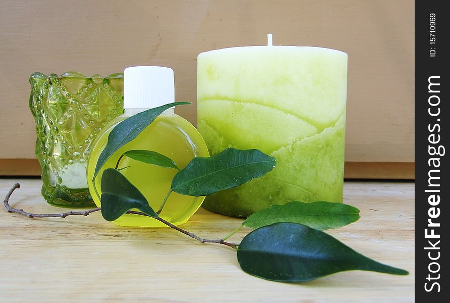 Green candle, soap bottle, leafs and glass. Green candle, soap bottle, leafs and glass.