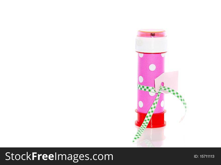 A colorful bubble blower as a handout gift with a name-card isolated over white