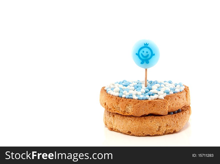 Dutch  traditional bicuits with blue white rusk are announcing a new born baby isolated over white. Dutch  traditional bicuits with blue white rusk are announcing a new born baby isolated over white