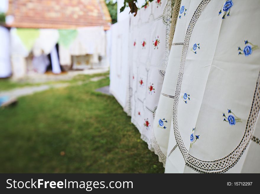 Tablecloth handmade drying on a wire. Tablecloth handmade drying on a wire