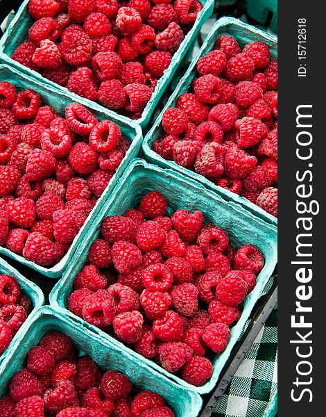 Fresh rasberries for sale at a local farmer's market