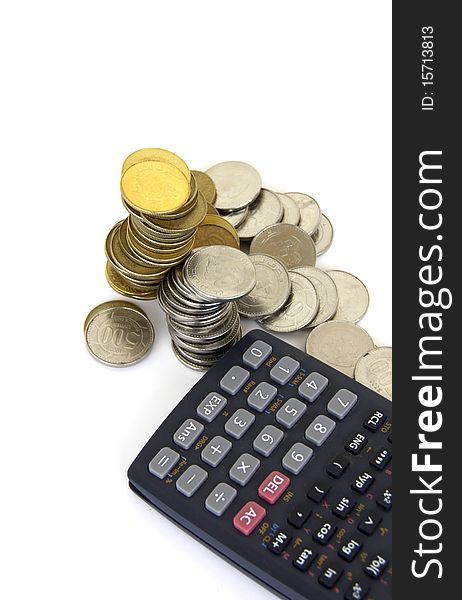 Calculator and money coins isolated on a white backgorund