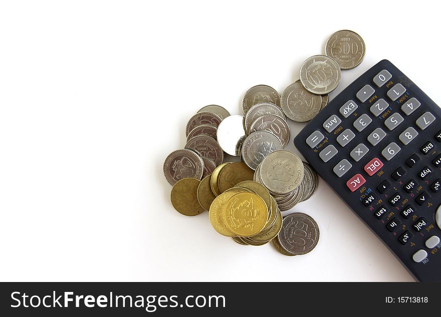 Calculator and money coins isolated on a white backgorund