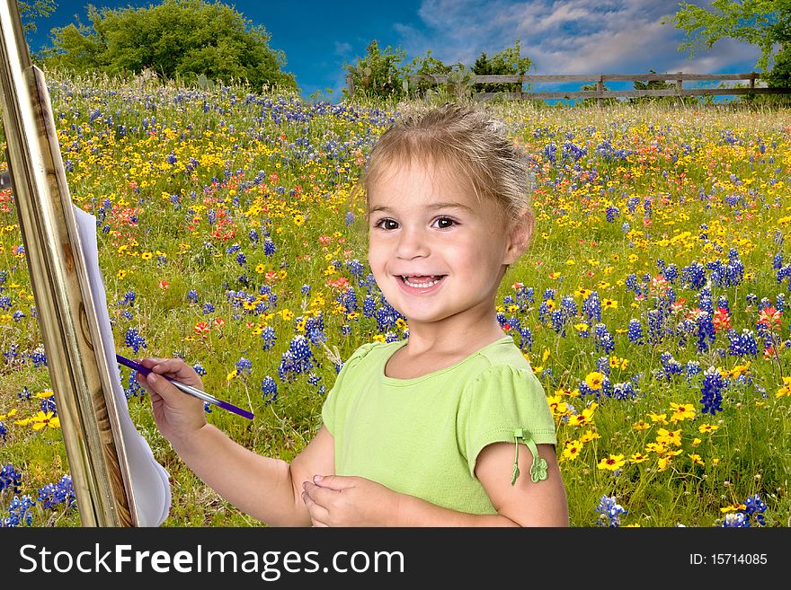 Pretty little 5 year old girl painting bluebonnets on her easel. Pretty little 5 year old girl painting bluebonnets on her easel.