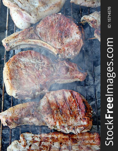 Variety traditional greek grilled meat steaks and chops on rack. Variety traditional greek grilled meat steaks and chops on rack