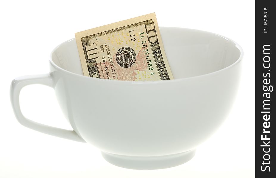 Conceptual: inflation: US Currency Ten Dollar Bill in a White Coffee Mug or it could be a soup cup, isolated on white background.