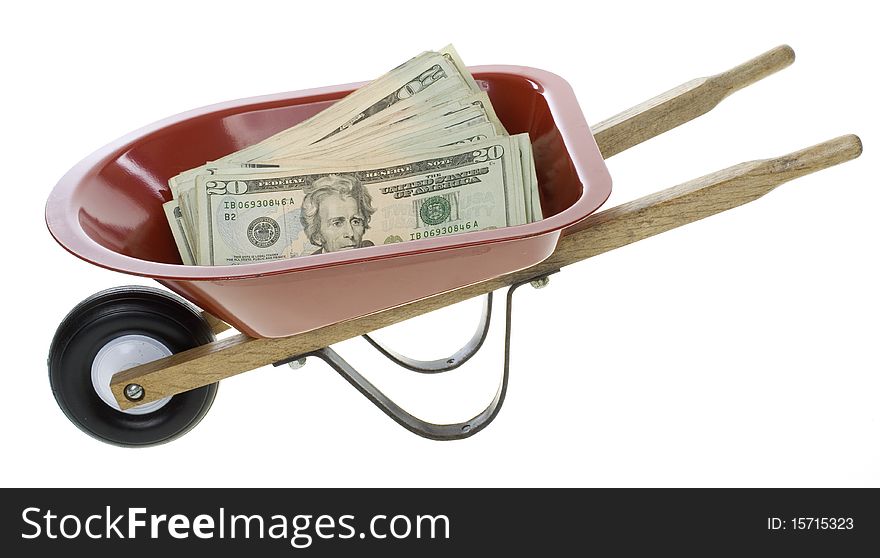 US Currency Twenty Dollar Bills in Red, miniature, toy, Wheelbarrow, isolated on white background. US Currency Twenty Dollar Bills in Red, miniature, toy, Wheelbarrow, isolated on white background.